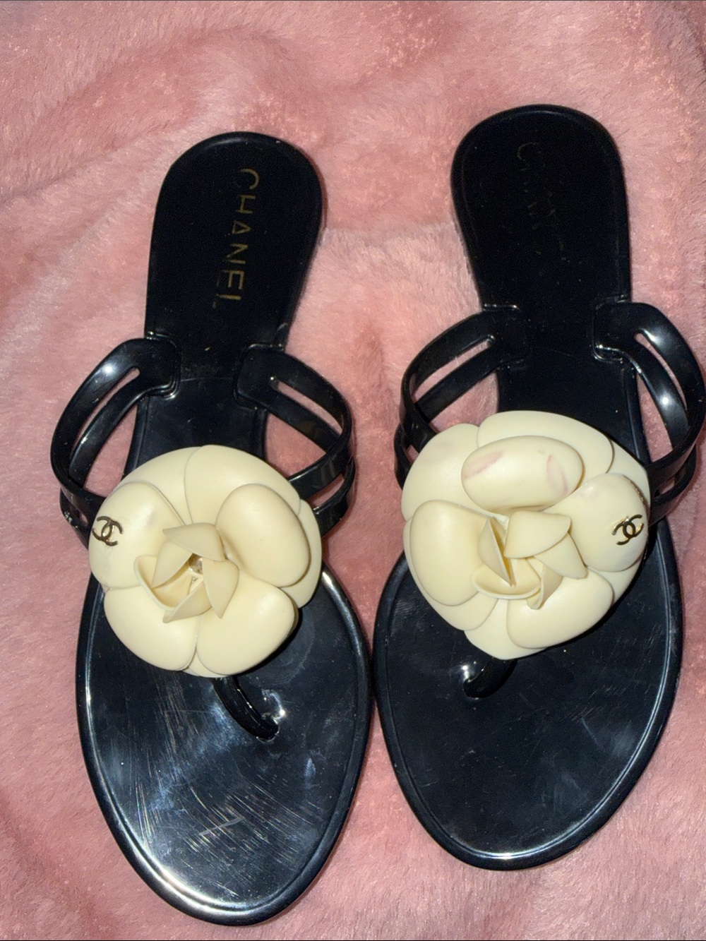 CHANEL Black Jelly Sandals with Cream Camellia Accent